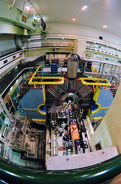 Fig. 1: The Belle detector at the KEKB accelerator in Tsukuba, Japan. The detector identifies particles produced by collisions between high-energy electrons and positrons by following the particle tracks in a 1.5 tesla magnetic field.