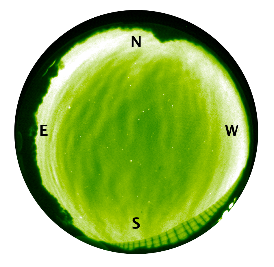 All-sky airglow image taken by the Optical Mesosphere and Thermosphere Imager (OMTI). The emission is from excited oxygen atoms at an altitude of 95 km. A north-south wave structure with a wavelength of ~50 km can be seen in the entire image.