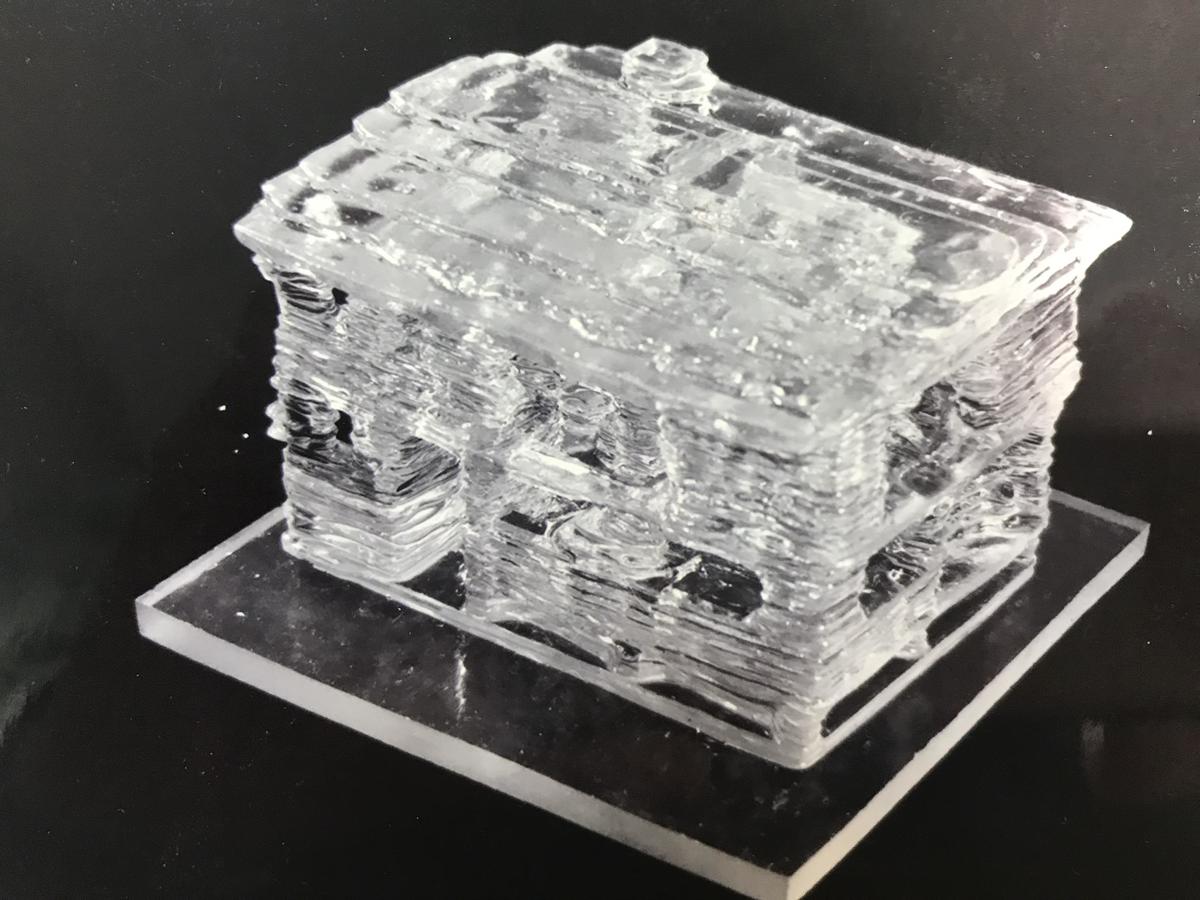 The model house, 5 centimeters tall and formed by 27 layers of resin each 2 millimeters thick. Kodama destroyed the original model, and only his photos remain