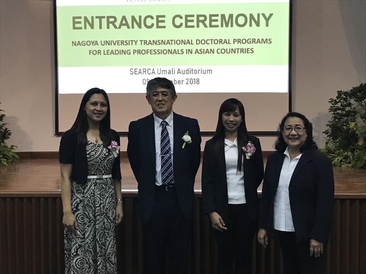 Two students stand beside Prof. Akira Yamauchi after the entrance ceremony to the Transnational Doctoral Programs for Leading Professionals in Asian Countries (at SEARCA)