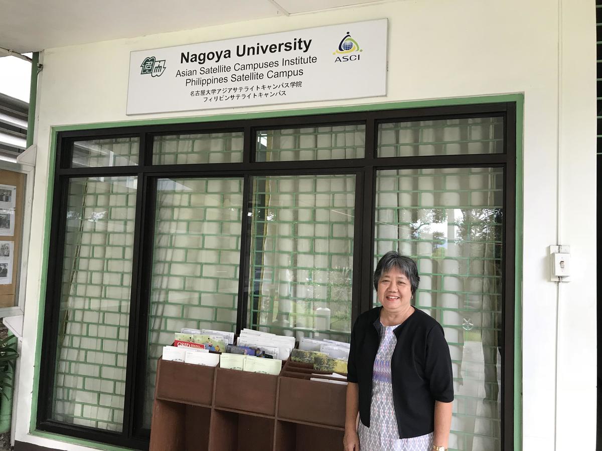 Designated Professor Editha Cedicol in front of the Philippines Satellite Campus office