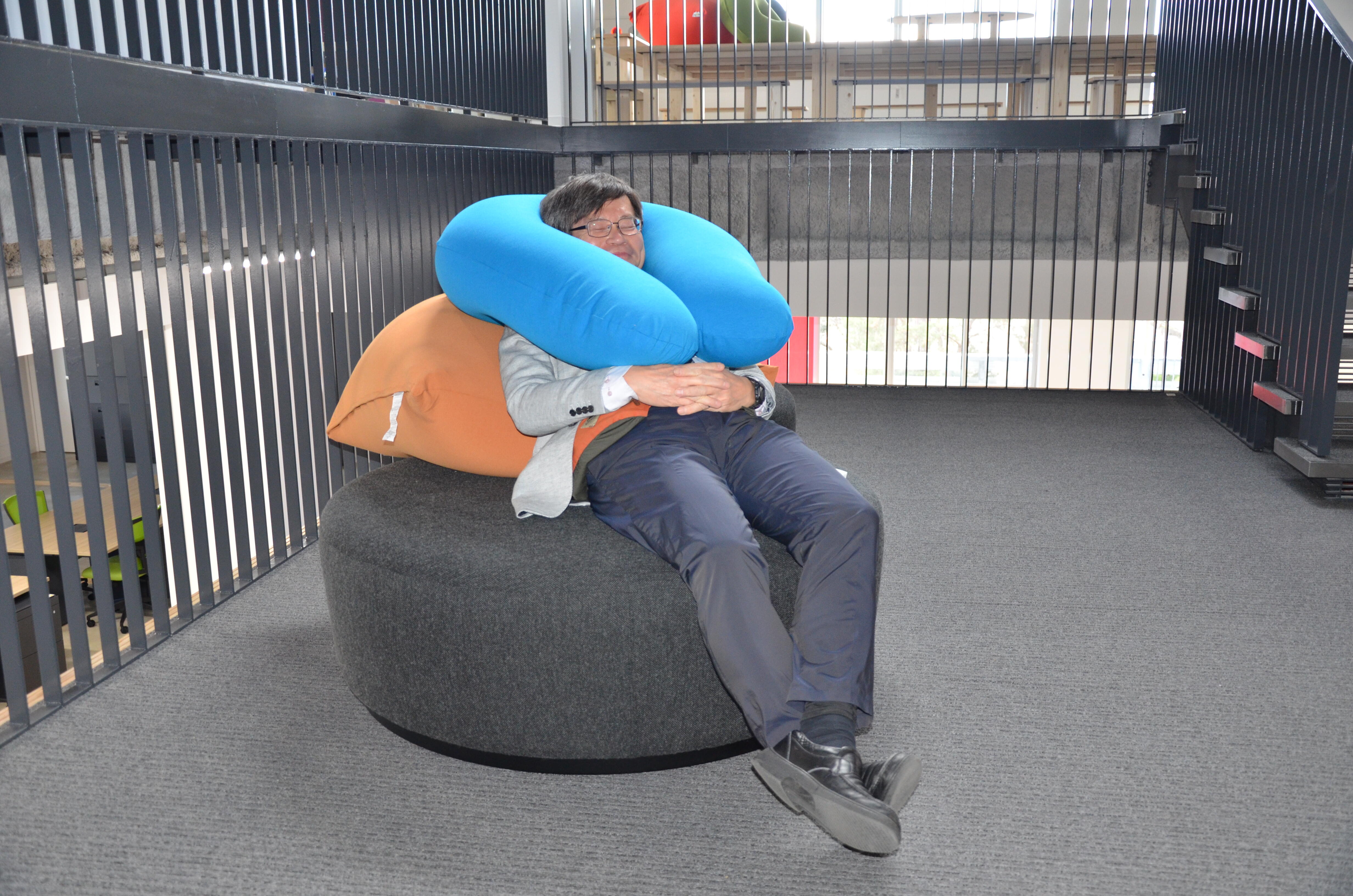 Relaxing himself in the lounge of his new office