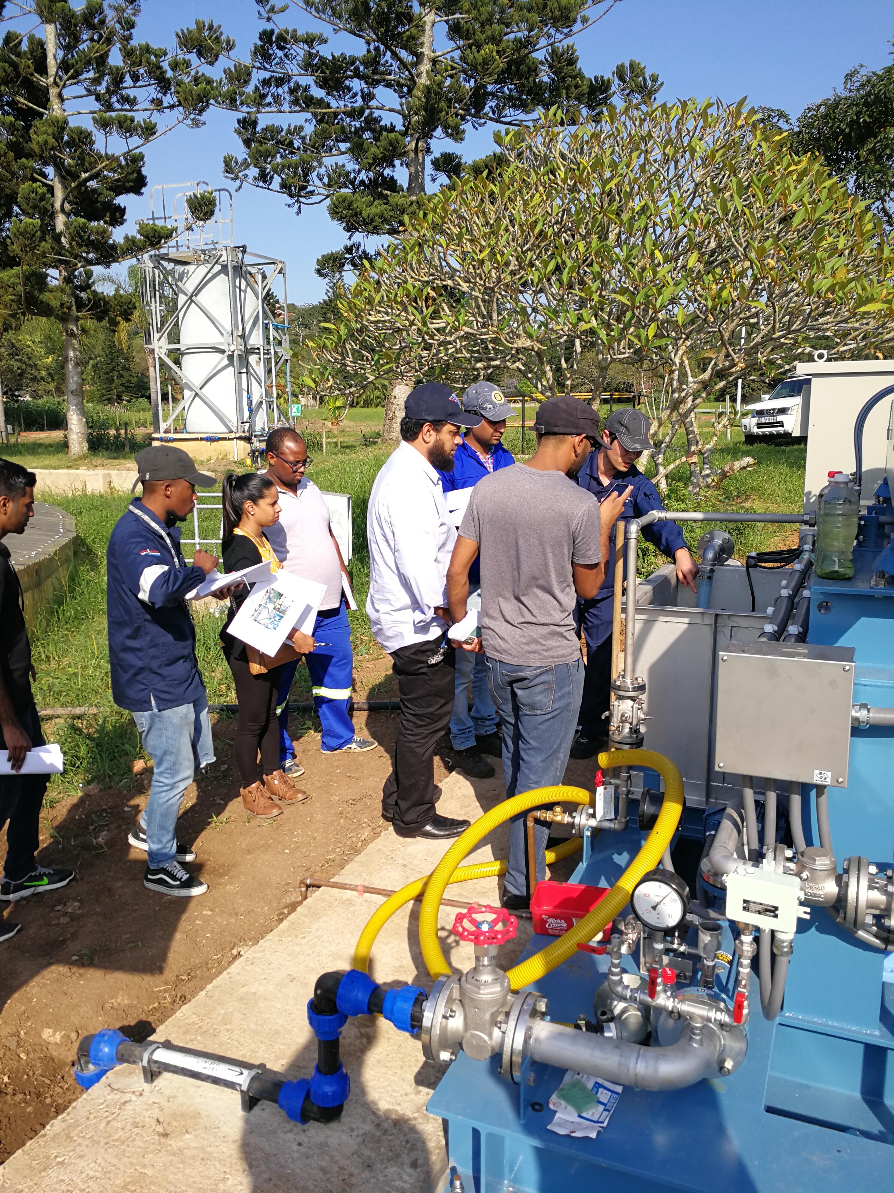 South African people listening to the explanation about the equipment