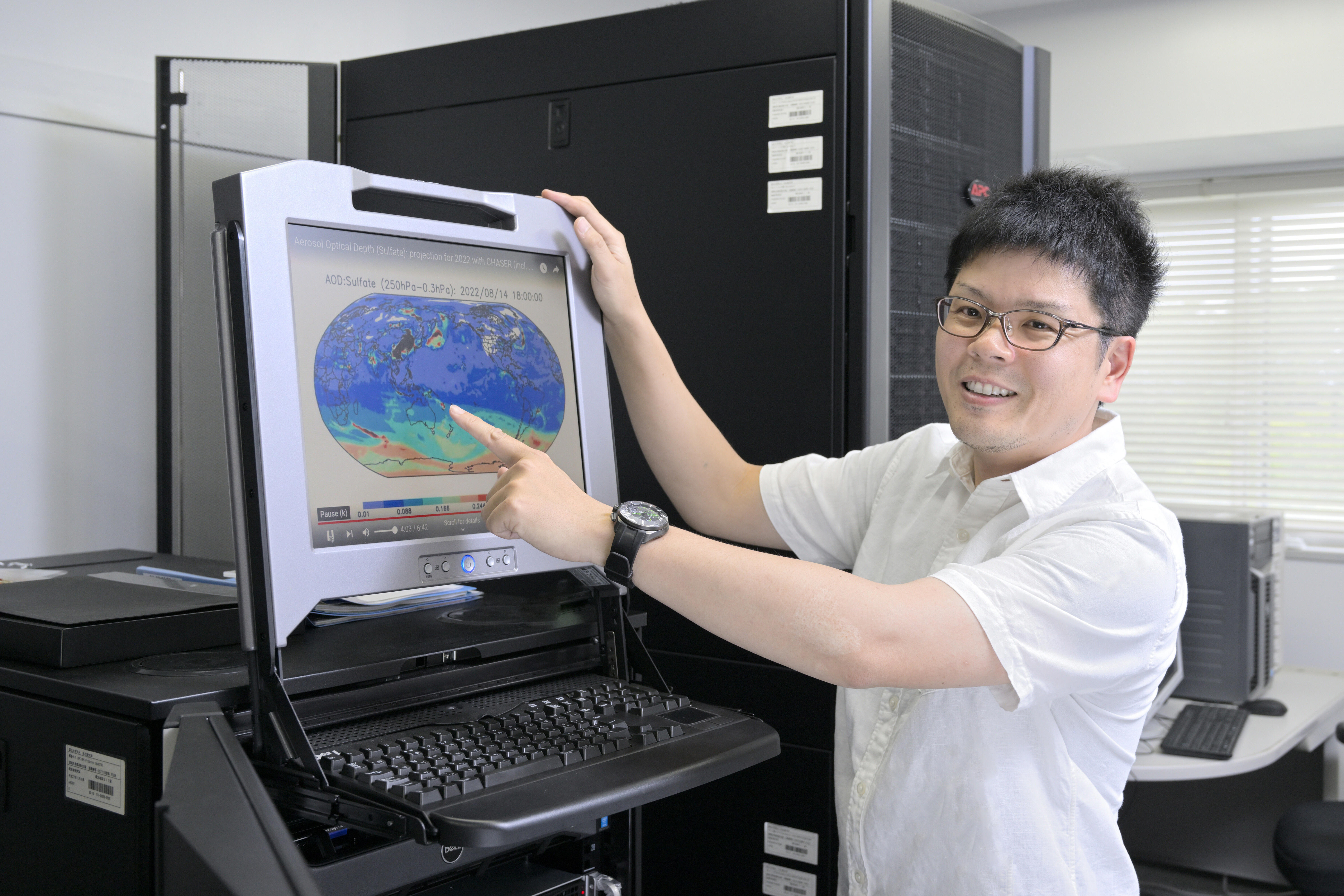 Explaining simulation results in his laboratory server room