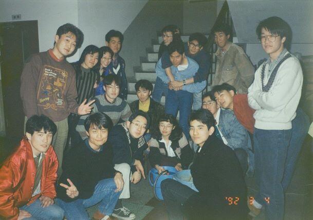 Doing an experiment in the hallway of the Physics Department building at Nagoya University. (He is the second from left in the front row.)