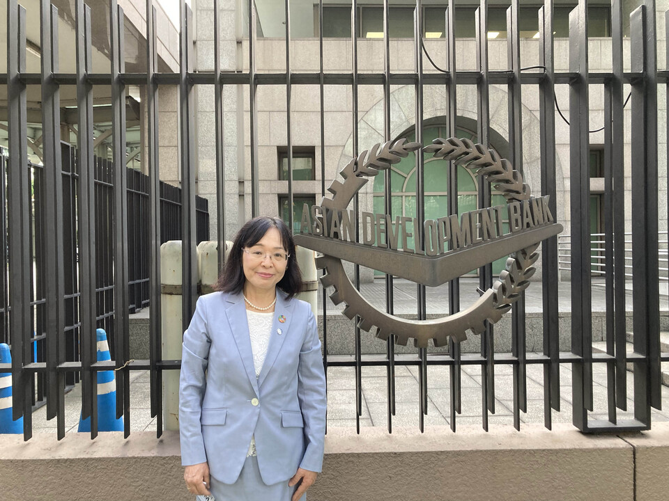 Dean Aya Okada of the Graduate School of International Development at the entrance of the Asian Development Bank. *(October 10, 2023)