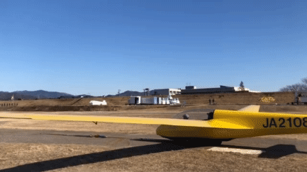 The glider is pulled down the runway by a winch