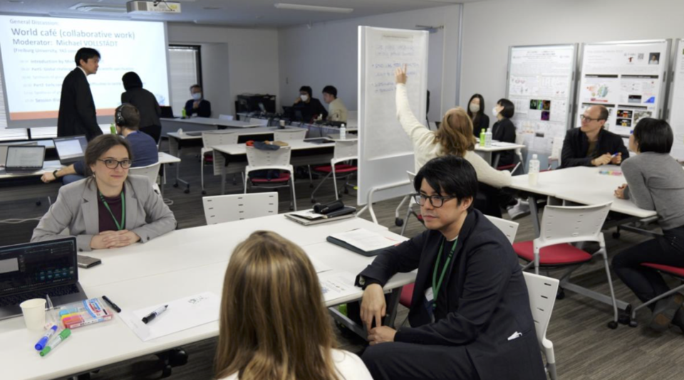 The participants formed focus groups for the World Café discussion