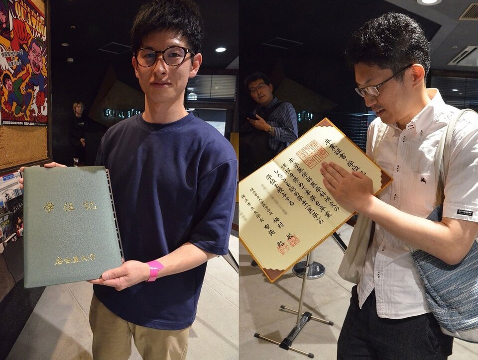 Passionate fans bring their diploma certificates to the shows!