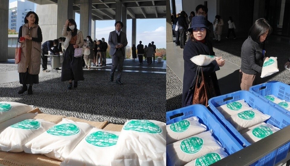Shoppers gather at Toyoda Auditorium to purchase rice from a university-affiliated field.