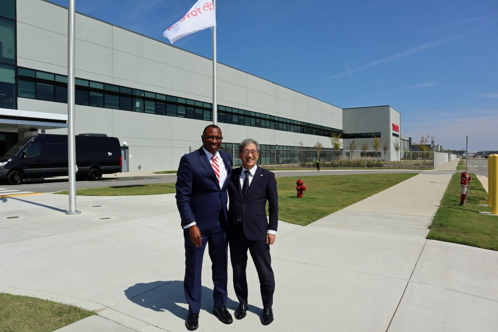 Nagoya University President Naoshi Sugiyama (right) and North Carolina State University Chancellor Kevin Howell (left) in front of Toyota Battery Manufacturing North Carolina