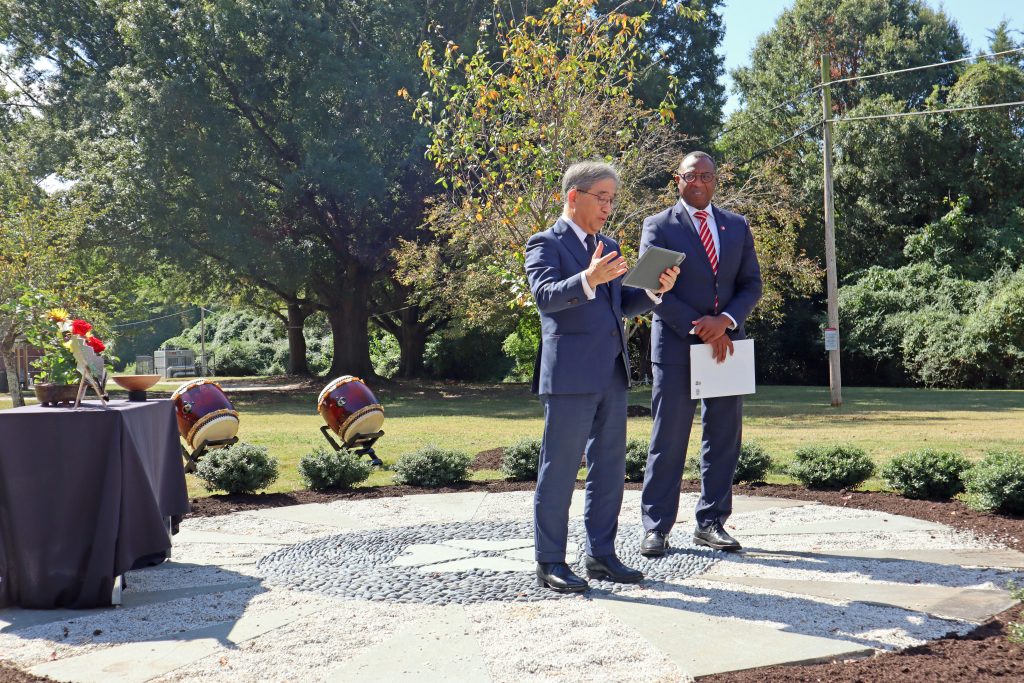 Nagoya University President Naoshi Sugiyama speaks at the dedication ceremony of three cherry trees