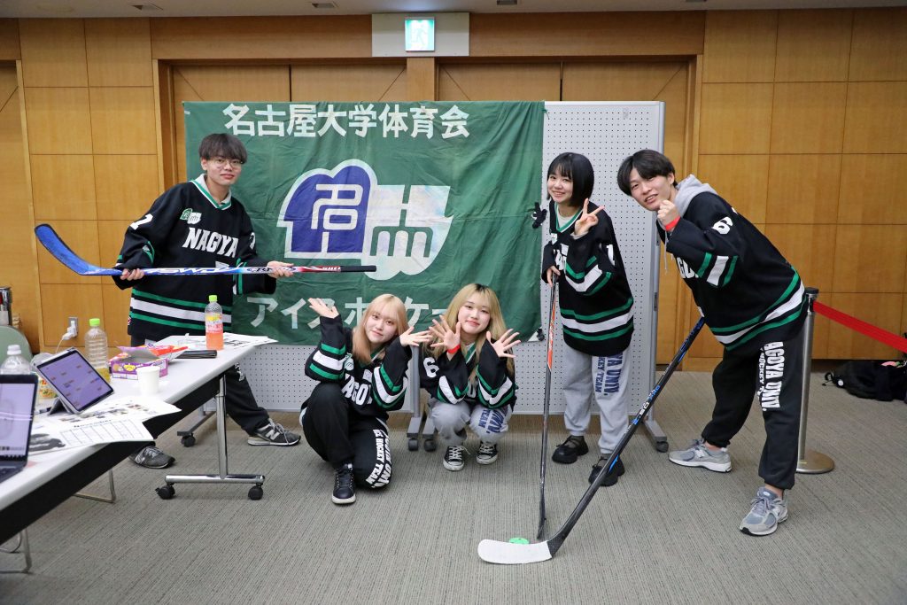 The Nagoya University Ice Hockey Team poses for a photo at their booth, hoping to attract new members