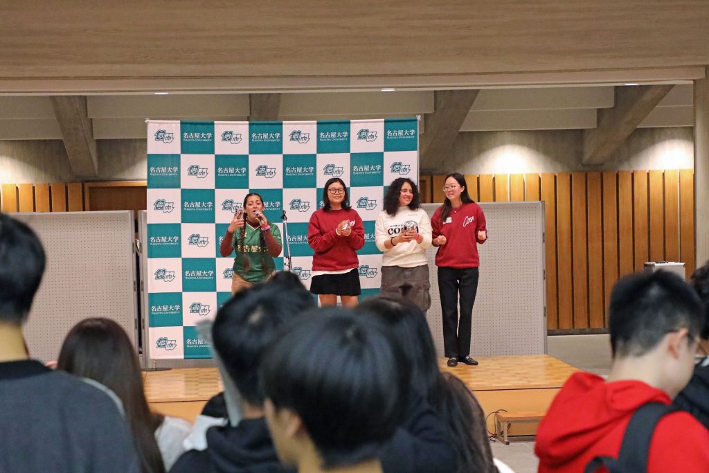 Some members of COFSA sing on stage to liven up the party