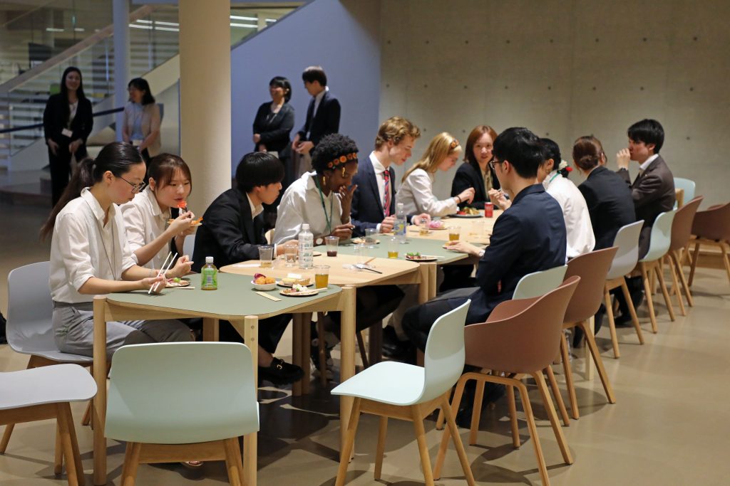 Students from Nagoya University and St John's College take a much earned break during a reception after their final presentation.