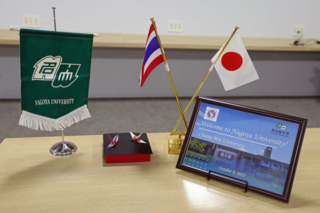 The Nagoya University banner next to Japanese and Thai flags