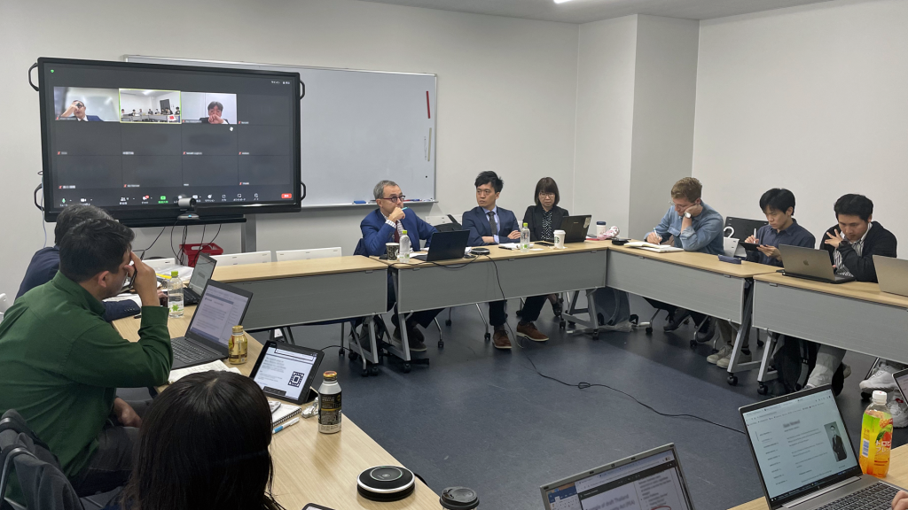 Participants sit at tables and listen to a special lecture at the Graduate School of Law in May 2024