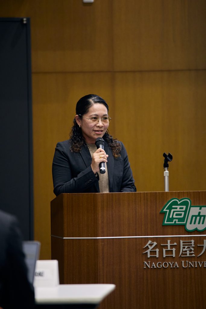 Marianne speaking at podium