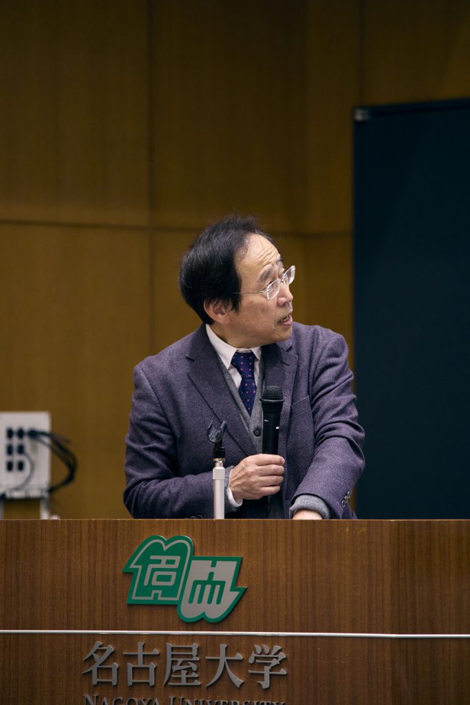 Professor Suzuki speaking at podium