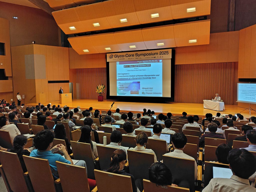 Participants sit in the main hall at Toyoda Auditorium during one of the presentations at the symposium.
