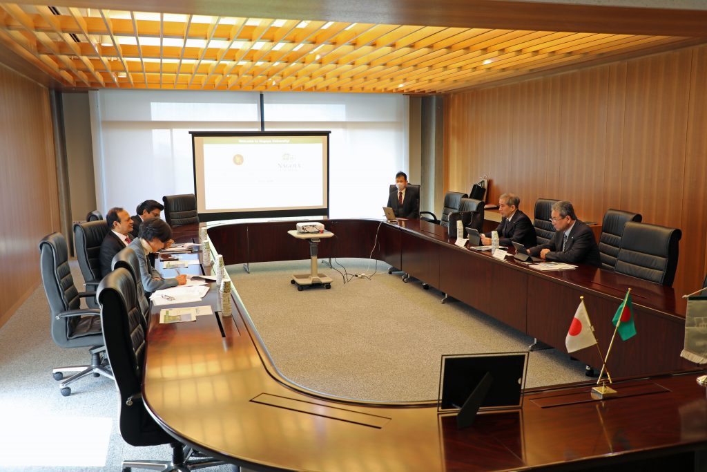 The delegation from the Embassy of the People's Republic of Bangladesh sits across a large, O-shaped table from the representatives from Nagoya University.
