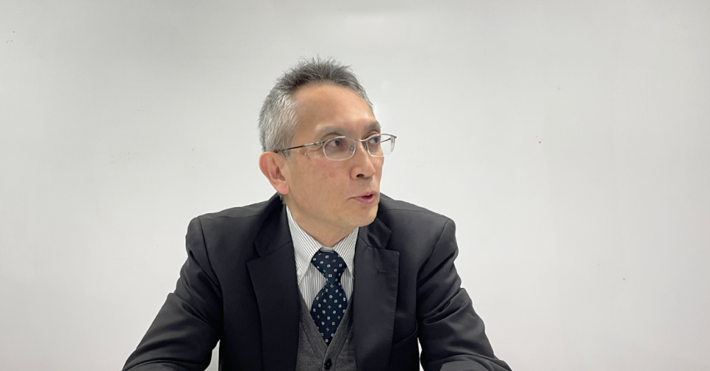 Masahiro Kito speaking during an interview with Toru Ujihara.